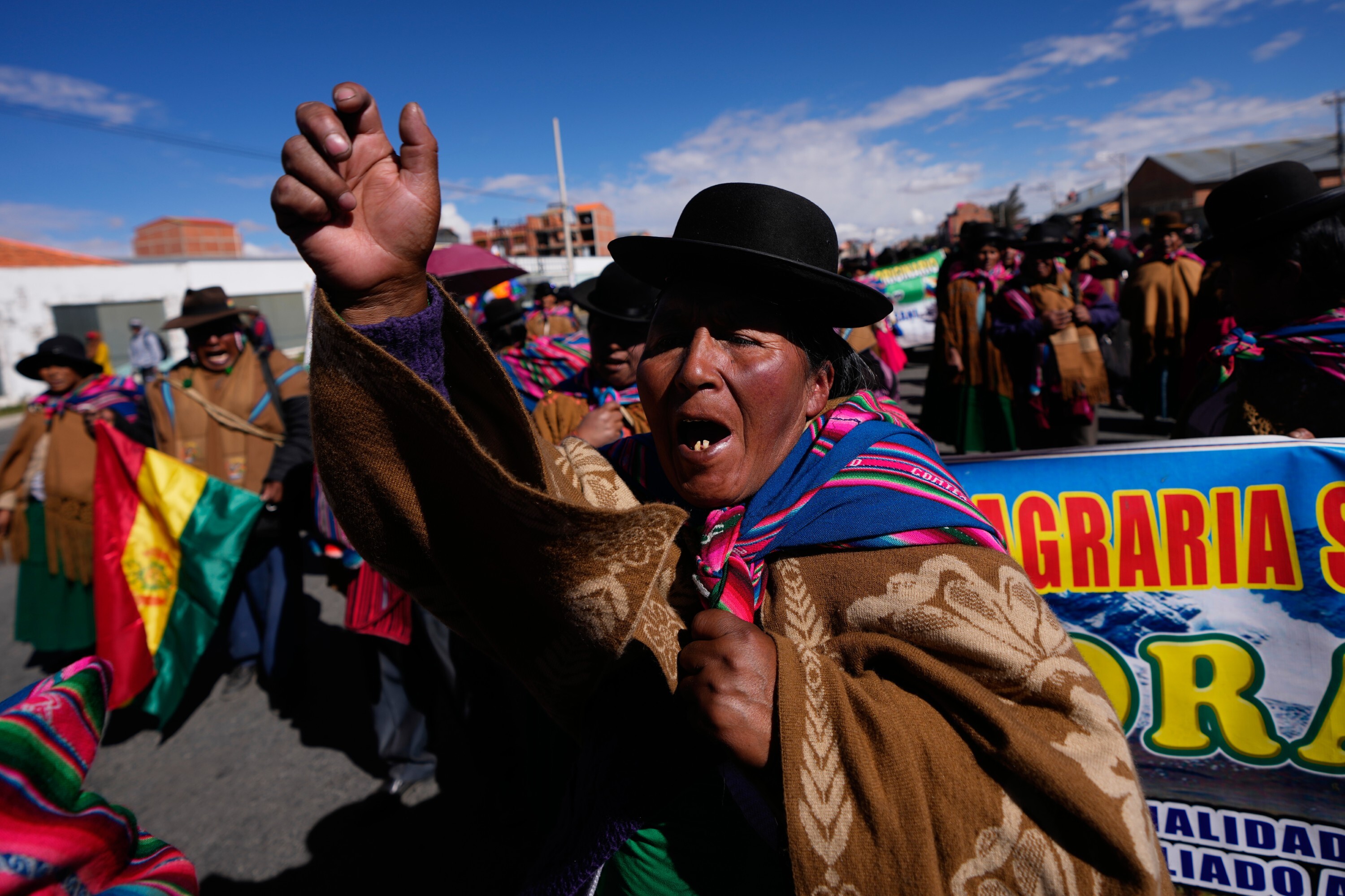 An Indigenous Aymara women shout slogans during an anti-government protest in El Alto, Bolivia, Wednesday, May 13, 2026. (AP Photo/Juan Karita)
