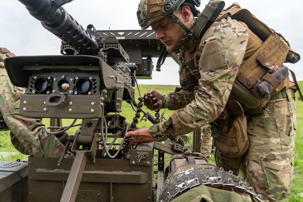 Ukrainian servicemen of the Cerberus Ground Unmanned Systems Company of the 60th Separate Mechanized Brigade, Third Army Corps, prepare for a drill with a combat ground drone during a training at the polygon in Kharkiv region, Ukraine, Sunday, May 24, 2026. (AP Photo/Andrii Marienko)